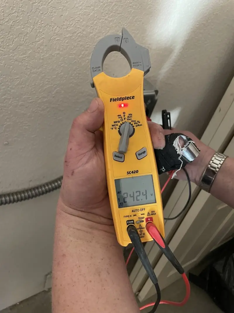 Voltage testing with clamp meter during Electrical Installation Services in Greenwich
